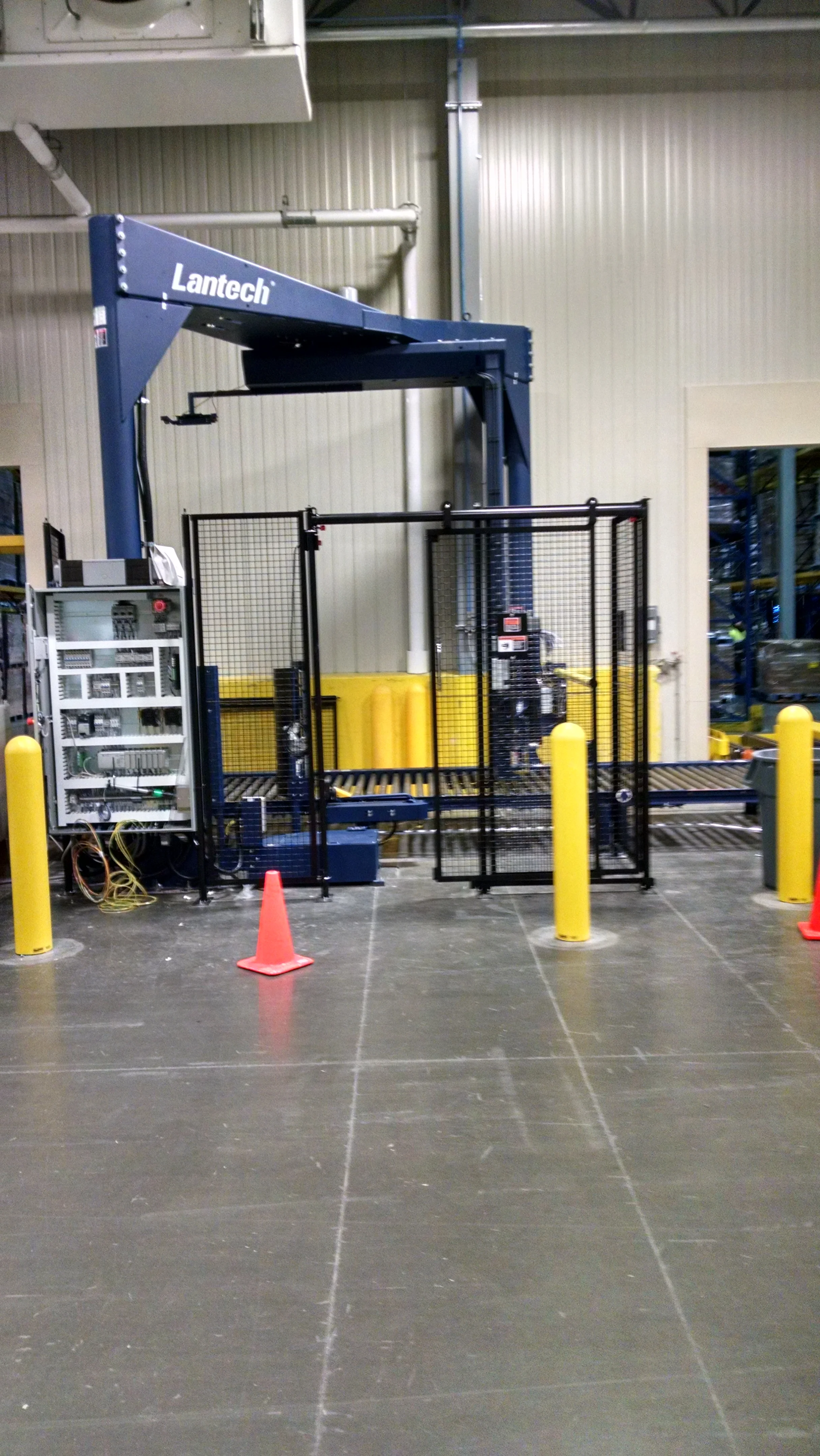Lantech automatic stretch wrap machine for pallet wrapping and load securing in a warehouse setting